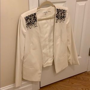 Calvin Klein blazer with beaded shoulder.